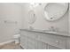 Bright bathroom features double sink vanity with granite countertop and modern fixtures at 3927 Villager Way, Rex, GA 30273