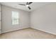 Neutral bedroom features a ceiling fan, and a window at 3927 Villager Way, Rex, GA 30273