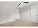Neutral bedroom features a ceiling fan, and two doors at 3927 Villager Way, Rex, GA 30273