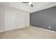 Bedroom featuring neutral walls, carpet, and white doors at 3927 Villager Way, Rex, GA 30273