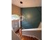 Lovely entryway boasts a modern light fixture and dark green accent wall at 3927 Villager Way, Rex, GA 30273