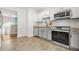 Updated kitchen with white cabinets, stainless steel appliances, wooden countertops and tile flooring at 3927 Villager Way, Rex, GA 30273