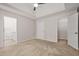 Spacious main bedroom features a ceiling fan and multiple closets at 3927 Villager Way, Rex, GA 30273