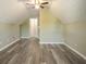 Bedroom with vaulted ceilings, a ceiling fan, and modern vinyl flooring at 7430 Valley Landing Ct, Cumming, GA 30041
