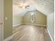 Spacious bedroom with vaulted ceilings, a ceiling fan, and luxury vinyl plank flooring at 7430 Valley Landing Ct, Cumming, GA 30041