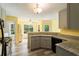 Sunlit kitchen with breakfast nook, stainless appliances, and wood-style floors at 7430 Valley Landing Ct, Cumming, GA 30041