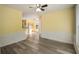 Bright living space features wood-style floors, trim work, and abundant natural light at 7430 Valley Landing Ct, Cumming, GA 30041