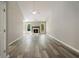 Bright living room with a fireplace, vaulted ceiling, and wood flooring at 7430 Valley Landing Ct, Cumming, GA 30041