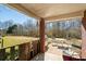Covered patio with outdoor seating and a view of the spacious backyard at 7430 Valley Landing Ct, Cumming, GA 30041