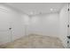 A clean and simple basement area with light wood-look floors and plenty of open space at 819 Loridans Ne Dr, Atlanta, GA 30342