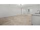 Finished basement space with light tile flooring, bar sink, and walkout door with a bright and open feel at 819 Loridans Ne Dr, Atlanta, GA 30342