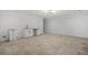 Finished basement space with tile flooring, ample space, bar sink, and bright modern lighting at 819 Loridans Ne Dr, Atlanta, GA 30342