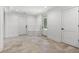 A large finished basement with a built-in bench, modern doors, and neutral paint at 819 Loridans Ne Dr, Atlanta, GA 30342