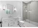 Clean bathroom with a shower over tub, and sleek vanity with modern fixtures and tiled walls at 819 Loridans Ne Dr, Atlanta, GA 30342