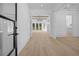 Bright foyer showcasing hardwood floors, a modern chandelier, and an open floor plan at 819 Loridans Ne Dr, Atlanta, GA 30342
