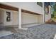 A two car garage and a brick driveway complement the modern, whitewashed brick exterior at 819 Loridans Ne Dr, Atlanta, GA 30342