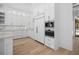 Gourmet kitchen features a built-in refrigerator, modern appliances, sleek cabinetry, and stone countertops and backsplash at 819 Loridans Ne Dr, Atlanta, GA 30342