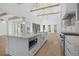 Chef's kitchen with stone countertops, high end appliances, a large center island, and exposed wooden beams at 819 Loridans Ne Dr, Atlanta, GA 30342