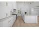 A chef's dream kitchen with premium appliances, custom cabinets, an island, and stone countertops at 819 Loridans Ne Dr, Atlanta, GA 30342