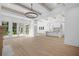 Bright living room with fireplace, access to back yard, and open view to the modern kitchen at 819 Loridans Ne Dr, Atlanta, GA 30342