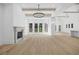 Inviting living room with hardwood floors, a fireplace, and a view to the outdoor area at 819 Loridans Ne Dr, Atlanta, GA 30342