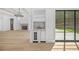 A large open space with a bar area, a fireplace and views out to the backyard at 819 Loridans Ne Dr, Atlanta, GA 30342