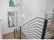 Modern staircase with hardwood treads and black railing, offering a unique design at 819 Loridans Ne Dr, Atlanta, GA 30342