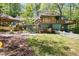 Large backyard featuring a playhouse, swing set, screened porch, and spiral staircase at 1326 Janmar Rd, Snellville, GA 30078