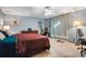 Cozy bedroom with a comfortable bed, dresser, and ample natural light from large window at 1326 Janmar Rd, Snellville, GA 30078