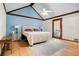 Bright bedroom featuring vaulted ceilings, hardwood floors, and access to a patio at 1326 Janmar Rd, Snellville, GA 30078