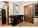 An entryway with hardwood floors, a stylish console table, and a decorative front door at 1326 Janmar Rd, Snellville, GA 30078