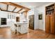 Bright kitchen with white cabinetry, stainless steel appliances and light wood floors at 1326 Janmar Rd, Snellville, GA 30078