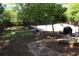 Spacious backyard with lush lawn, a pool, and a grill area, ideal for outdoor activities and relaxation at 545 Chaseridge Dr, Mcdonough, GA 30253