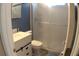 Modern bathroom features a white vanity, toilet and glass-enclosed shower at 545 Chaseridge Dr, Mcdonough, GA 30253