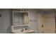 This bathroom includes a sink, vanity mirror, towel rack, and shower at 545 Chaseridge Dr, Mcdonough, GA 30253