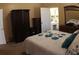 Spacious bedroom with king-size bed, large wardrobe, and ensuite bathroom at 545 Chaseridge Dr, Mcdonough, GA 30253