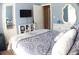 Charming bedroom with soft blue walls and a decorative mirror and dresser at 545 Chaseridge Dr, Mcdonough, GA 30253