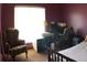 Bedroom has a large window with a dark purple paint on the walls at 545 Chaseridge Dr, Mcdonough, GA 30253