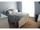 Cozy bedroom with large window, white furniture and neutral carpet at 545 Chaseridge Dr, Mcdonough, GA 30253