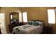 Main bedroom with a dresser, mirror, king size bed and ensuite bathroom at 545 Chaseridge Dr, Mcdonough, GA 30253