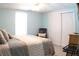 Bright bedroom features a plush bed, convenient closet space, and ample natural light at 545 Chaseridge Dr, Mcdonough, GA 30253