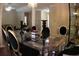 Refined dining room showcasing an elegant glass table, decorative accents, and a sophisticated ambiance at 545 Chaseridge Dr, Mcdonough, GA 30253