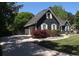 View of home's driveway and attached garage, featuring manicured landscaping and a well-maintained exterior at 545 Chaseridge Dr, Mcdonough, GA 30253