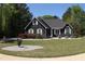 Charming one-story home with a well-manicured lawn and mature trees, offering a serene and inviting curb appeal at 545 Chaseridge Dr, Mcdonough, GA 30253