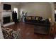 Spacious living room with hardwood floors and a cozy fireplace, perfect for relaxing and entertaining guests at 545 Chaseridge Dr, Mcdonough, GA 30253