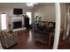 Inviting living room with natural light, a fireplace, and comfortable seating, creating a warm and welcoming atmosphere at 545 Chaseridge Dr, Mcdonough, GA 30253