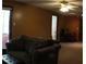 Spacious living room with comfortable seating, natural light, and access to the outdoors at 545 Chaseridge Dr, Mcdonough, GA 30253