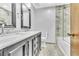 Bathroom featuring a double vanity, marble countertops, and stand-up shower at 9082 Chestnut Lake Dr, Jonesboro, GA 30236