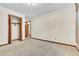 This spacious bedroom features a built-in closet and neutral carpeting at 9082 Chestnut Lake Dr, Jonesboro, GA 30236