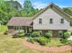 Charming home featuring brick accents, a manicured lawn, and a delightful brick walkway at 9082 Chestnut Lake Dr, Jonesboro, GA 30236